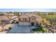 Stunning two-story home with three-car garage and manicured lawn at 2415 W Desperado Way, Phoenix, AZ 85085