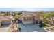 Luxury two-story house with a three-car garage, beautiful landscaping, and a large yard at 2415 W Desperado Way, Phoenix, AZ 85085