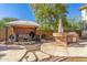Backyard oasis with outdoor kitchen and seating area at 2415 W Desperado Way, Phoenix, AZ 85085