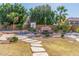 Landscaped backyard with stone pathway and pool at 2415 W Desperado Way, Phoenix, AZ 85085