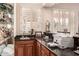 Well-equipped bar with sink, cabinetry, and granite counters at 2415 W Desperado Way, Phoenix, AZ 85085