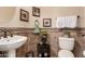 Bathroom features updated fixtures and decorative tile at 2415 W Desperado Way, Phoenix, AZ 85085