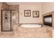 Spa-like bathroom with soaking tub, shower, and fireplace at 2415 W Desperado Way, Phoenix, AZ 85085