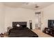 Cozy bedroom with a queen bed, TV, and plenty of closet space at 2415 W Desperado Way, Phoenix, AZ 85085