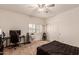 Bedroom with a gaming setup and small Christmas tree at 2415 W Desperado Way, Phoenix, AZ 85085