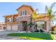 Two-story house with three-car garage and landscaped front yard at 2415 W Desperado Way, Phoenix, AZ 85085