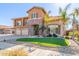 Two-story house with three-car garage and landscaped front yard at 2415 W Desperado Way, Phoenix, AZ 85085