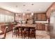 Gourmet kitchen with granite countertops and stainless steel appliances at 2415 W Desperado Way, Phoenix, AZ 85085