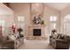 Spacious living room with large fireplace and high ceilings at 2415 W Desperado Way, Phoenix, AZ 85085