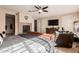 Main bedroom with large TV and desk area at 2415 W Desperado Way, Phoenix, AZ 85085