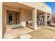 Relaxing backyard patio with seating and access to the home at 2415 W Desperado Way, Phoenix, AZ 85085
