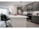 Modern kitchen with gray cabinets, white counters and stainless steel appliances at 2511 W Queen Creek Rd # 117, Chandler, AZ 85248