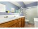 Bathroom with double sinks and a shower/tub combo at 28452 N Crimm Rd, San Tan Valley, AZ 85143