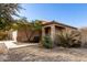 One-story house with tan exterior, walkway, and desert landscaping at 28452 N Crimm Rd, San Tan Valley, AZ 85143