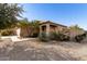 One-story house with tan exterior, walkway, and desert landscaping at 28452 N Crimm Rd, San Tan Valley, AZ 85143