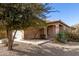 One-story house with tan exterior, walkway, and desert landscaping at 28452 N Crimm Rd, San Tan Valley, AZ 85143
