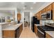 Open kitchen features stainless steel appliances and a large sink at 28452 N Crimm Rd, San Tan Valley, AZ 85143