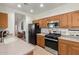 Kitchen with stainless steel appliances and wood cabinets at 28452 N Crimm Rd, San Tan Valley, AZ 85143