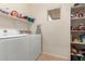 Laundry room with washer, dryer, and shelving at 28452 N Crimm Rd, San Tan Valley, AZ 85143