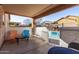 Covered patio with seating and pool access at 28452 N Crimm Rd, San Tan Valley, AZ 85143