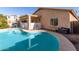 Relaxing kidney-shaped pool with patio access at 28452 N Crimm Rd, San Tan Valley, AZ 85143