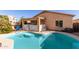 Inviting backyard swimming pool with patio and covered seating area at 28452 N Crimm Rd, San Tan Valley, AZ 85143