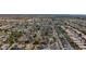 Scenic aerial view of a neighborhood with lush greenery, swimming pools, and well-maintained streets at 3024 E Siesta Ln, Phoenix, AZ 85050