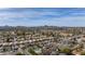 Panoramic aerial shot of a residential community with single-Gathering homes and mountain backdrop at 3024 E Siesta Ln, Phoenix, AZ 85050