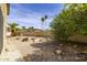 Private backyard with lush landscaping, a water feature, and a cozy fire pit at 3024 E Siesta Ln, Phoenix, AZ 85050
