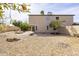 Expansive backyard with low maintenance desert landscaping and citrus tree at 3024 E Siesta Ln, Phoenix, AZ 85050
