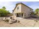 Spacious backyard featuring low maintenance desert landscaping with a covered patio and fountain at 3024 E Siesta Ln, Phoenix, AZ 85050