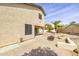 View of the rear of the home with a fire pit and a covered patio at 3024 E Siesta Ln, Phoenix, AZ 85050