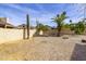 Spacious backyard featuring low maintenance desert landscaping, a cactus and palm trees at 3024 E Siesta Ln, Phoenix, AZ 85050