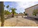 Large backyard featuring low maintenance desert landscaping, a citrus tree, and cacti at 3024 E Siesta Ln, Phoenix, AZ 85050