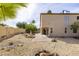 Large backyard with low maintenance landscaping featuring a fountain, firepit, and covered patio at 3024 E Siesta Ln, Phoenix, AZ 85050