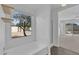 Bright bathroom features a tub under a window and doorway to a bedroom at 3024 E Siesta Ln, Phoenix, AZ 85050