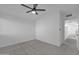 A bright bedroom features neutral carpet and a modern ceiling fan fixture at 3024 E Siesta Ln, Phoenix, AZ 85050