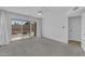 Bright bedroom with carpet, ceiling fan and sliding glass door leading to patio at 3024 E Siesta Ln, Phoenix, AZ 85050