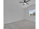 This bedroom features neutral carpet, ceiling fan, and a bright window at 3024 E Siesta Ln, Phoenix, AZ 85050