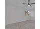 This bedroom has neutral carpet and light-filled windows with a ceiling fan at 3024 E Siesta Ln, Phoenix, AZ 85050