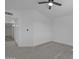 A bright, carpeted bedroom features a ceiling fan and neutral color palette at 3024 E Siesta Ln, Phoenix, AZ 85050