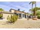 Charming two-story home featuring desert landscaping with a mix of rock and pebble ground covering at 3024 E Siesta Ln, Phoenix, AZ 85050