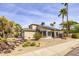 Charming two-story home featuring desert landscaping with a mix of rock and pebble ground covering at 3024 E Siesta Ln, Phoenix, AZ 85050