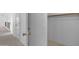 Hallway leads to a closet with ample storage space and built in shelving at 3024 E Siesta Ln, Phoenix, AZ 85050