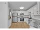 Updated kitchen featuring stainless steel appliances, granite countertops, and ample cabinet space at 3024 E Siesta Ln, Phoenix, AZ 85050