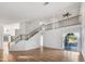 Bright living room with tiled floors, a staircase, and patio access at 3024 E Siesta Ln, Phoenix, AZ 85050