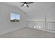 Carpeted loft provides a comfortable space with natural light from the window at 3024 E Siesta Ln, Phoenix, AZ 85050