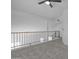Upstairs loft featuring carpet and a stylish railing at 3024 E Siesta Ln, Phoenix, AZ 85050