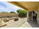 Enjoy outdoor living on this covered patio with a fire pit and mature landscaping at 3024 E Siesta Ln, Phoenix, AZ 85050