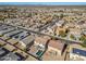 Aerial view of a community with houses, pools, and solar panels at 30313 W Mitchell Ave, Buckeye, AZ 85396